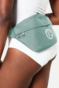 Sporty woman with green fanny pack with logo streetwear studio shoot