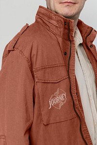 Man wearing brown jacket printed with journey logo 