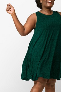 African American woman wearing green tent dress