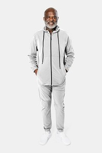 Senior man in light gray tracksuit sportswear fashion portrait full body