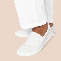 White slip-on shoes casual apparel close up with design space