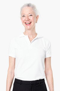 Happy senior woman in white polo shirt with design space studio portrait close up