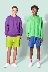 Teenage boys in purple sweater and green for streetwear apparel shoot