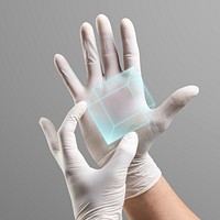 Doctor in medical gloves holding a hologram cubic