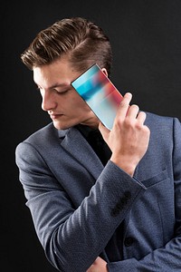 Businessman in suit show his smartphone device 
