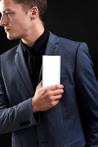 Businessman in suit showing his smartphone device