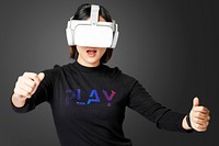 Woman playing games with VR goggles black background