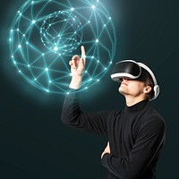 Man experiencing metaverse, wearing VR goggles pointing at holography globe