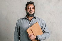 Proud Indian man carrying a laptop pouch