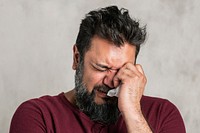 Sick emotional Indian man crying 