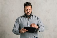 Engineer writing a report on a paper clipboard