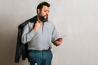 Happy Indian businessman checking his flight ticket 