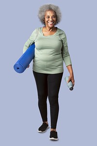 Happy black senior woman with a yoga mat and a water bottle mockup 