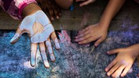 Blue chalk paint on kid hand banner