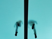 The shoeprints of two people walking on a level above seen through a translucent ceiling. Original public domain image from Wikimedia Commons