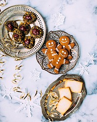 Plats of Christmas cookies and holiday treats on a tabletop. Original public domain image from <a href="https://commons.wikimedia.org/wiki/File:Christmas_Treats_(Unsplash).jpg" target="_blank" rel="noopener noreferrer nofollow">Wikimedia Commons</a>