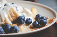 Macro shot of blueberries and yogurt on a homemade dessert tart. Original public domain image from <a href="https://commons.wikimedia.org/wiki/File:Blueberry_Dessert_(Unsplash).jpg" target="_blank" rel="noopener noreferrer nofollow">Wikimedia Commons</a>