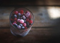 Tall glass of frozen blueberries, raspberries, and assorted berries. Original public domain image from <a href="https://commons.wikimedia.org/wiki/File:Frozen_berries_(Unsplash).jpg" target="_blank" rel="noopener noreferrer nofollow">Wikimedia Commons</a>
