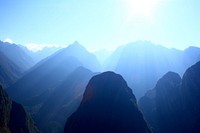 Sunlight fills green mountain valleys near Machu Picchu. Original public domain image from <a href="https://commons.wikimedia.org/wiki/File:Sun_over_green_mountains_(Unsplash).jpg" target="_blank" rel="noopener noreferrer nofollow">Wikimedia Commons</a>