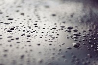 Droplets of water on a smooth metallic surface. Original public domain image from <a href="https://commons.wikimedia.org/wiki/File:Water_on_a_metallic_surface_(Unsplash).jpg" target="_blank" rel="noopener noreferrer nofollow">Wikimedia Commons</a>