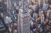 A helicopter view of the Empire State building.. Original public domain image from <a href="https://commons.wikimedia.org/wiki/File:Empire_Views_(Unsplash).jpg" target="_blank" rel="noopener noreferrer nofollow">Wikimedia Commons</a>