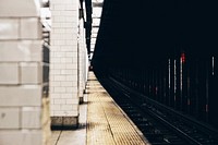 The view from the edge of the platform reveals a long stretch of subway track.. Original public domain image from Wikimedia Commons