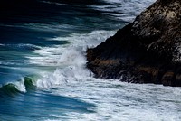 Waves crashing on the rocky coastline at Heceta Beach. Original public domain image from Wikimedia Commons
