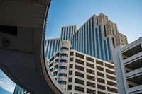 An overpass next to tall concrete buildings in a city. Original public domain image from <a href="https://commons.wikimedia.org/wiki/File:Reno_(Unsplash).jpg" target="_blank" rel="noopener noreferrer nofollow">Wikimedia Commons</a>