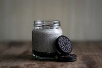 Mason jar of a sweet dessert with oreo cookies on a table. Original public domain image from <a href="https://commons.wikimedia.org/wiki/File:OREO_(Unsplash).jpg" target="_blank" rel="noopener noreferrer nofollow">Wikimedia Commons</a>