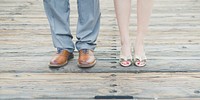 A man and woman's feet in nice shoes and dress pants for a wedding in San Francisco. Original public domain image from Wikimedia Commons