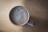 A frothy cup of coffee in a white mug in Portsmouth. Original public domain image from <a href="https://commons.wikimedia.org/wiki/File:Portsmouth_coffee_(Unsplash).jpg" target="_blank" rel="noopener noreferrer nofollow">Wikimedia Commons</a>