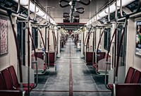 View of a long empty subway train interior in Toronto. Original public domain image from Wikimedia Commons