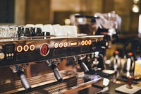 Dials and lights on a coffee machine. Original public domain image from <a href="https://commons.wikimedia.org/wiki/File:Modern_coffee_machine_(Unsplash).jpg" target="_blank" rel="noopener noreferrer nofollow">Wikimedia Commons</a>