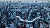 Endless lines of full bike racks with bicycles. Original public domain image from Wikimedia Commons