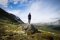 Woman standing in rugged landscape. Original public domain image from <a href="https://commons.wikimedia.org/wiki/File:Philipp_Lublasser_2017_(Unsplash).jpg" target="_blank">Wikimedia Commons</a>