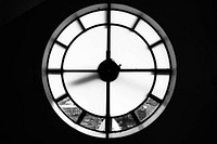Macro black and white shot of round clock on dark background, Hallgrimskirkja. Original public domain image from <a href="https://commons.wikimedia.org/wiki/File:Hallgrimskirkja_-_Tower_Clock_(Unsplash).jpg" target="_blank" rel="noopener noreferrer nofollow">Wikimedia Commons</a>