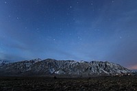 Starry night sky over a snow-topped mountain range near Mammoth Lakes. Original public domain image from <a href="https://commons.wikimedia.org/wiki/File:Starry_Morning_(Unsplash).jpg" target="_blank" rel="noopener noreferrer nofollow">Wikimedia Commons</a>