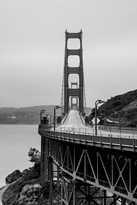 Black and white shot of Golden Gate Bridge Vista Point with empty road. Original public domain image from Wikimedia Commons