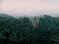 Craggy mountains on Majorca on a cloudy day. Original public domain image from <a href="https://commons.wikimedia.org/wiki/File:Sunset_over_Mallorcan_mountains_(Unsplash).jpg" target="_blank" rel="noopener noreferrer nofollow">Wikimedia Commons</a>