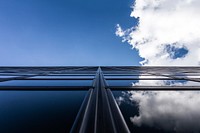 Clouds and blue sky reflected in windows of a modern building. Original public domain image from <a href="https://commons.wikimedia.org/wiki/File:Windows_reflecting_sky_(Unsplash).jpg" target="_blank" rel="noopener noreferrer nofollow">Wikimedia Commons</a>