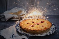 Sparklers lit in a fresh berry pie. Original public domain image from Wikimedia Commons