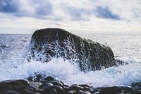 Ocean splashing on a rock in Mølen. Original public domain image from <a href="https://commons.wikimedia.org/wiki/File:Rock_wetted_by_waves_(Unsplash).jpg" target="_blank" rel="noopener noreferrer nofollow">Wikimedia Commons</a>
