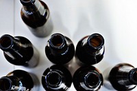 The macro view of the top of open and empty beer bottles. Original public domain image from <a href="https://commons.wikimedia.org/wiki/File:Open_beer_bottles_(Unsplash).jpg" target="_blank" rel="noopener noreferrer nofollow">Wikimedia Commons</a>