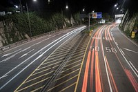 Car headlights form red streaks speeding over a highway. Original public domain image from Wikimedia Commons