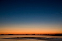 A calm and tranquil sunset over the sea in La Azohia, Murcia, Spain. Original public domain image from Wikimedia Commons