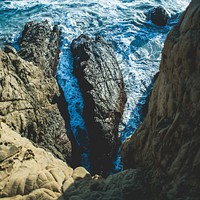 Ocean rocks viewed from a coastline cliff at Pfeiffer State Beach. Original public domain image from Wikimedia Commons