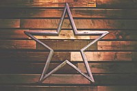 A wooden decoration in the shape of a hollow star against a wooden wall. Original public domain image from <a href="https://commons.wikimedia.org/wiki/File:Wooden_Star_(Unsplash).jpg" target="_blank" rel="noopener noreferrer nofollow">Wikimedia Commons</a>