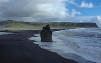 Large rock on the black sand beach in Reynisfjara. Original public domain image from <a href="https://commons.wikimedia.org/wiki/File:Rock_on_black_sand_beach_(Unsplash).jpg" target="_blank" rel="noopener noreferrer nofollow">Wikimedia Commons</a>