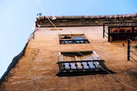 A low-angle shot of the dilapidated facade of an old building. Original public domain image from <a href="https://commons.wikimedia.org/wiki/File:Abandoned_building_facade_(Unsplash).jpg" target="_blank" rel="noopener noreferrer nofollow">Wikimedia Commons</a>