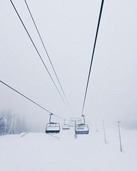 Foggy chairlift at Mont-Tremblant, Québec, Canada.. Original public domain image from <a href="https://commons.wikimedia.org/wiki/File:Quebec_ski_hill_cars_(Unsplash).jpg" target="_blank" rel="noopener noreferrer nofollow">Wikimedia Commons</a>